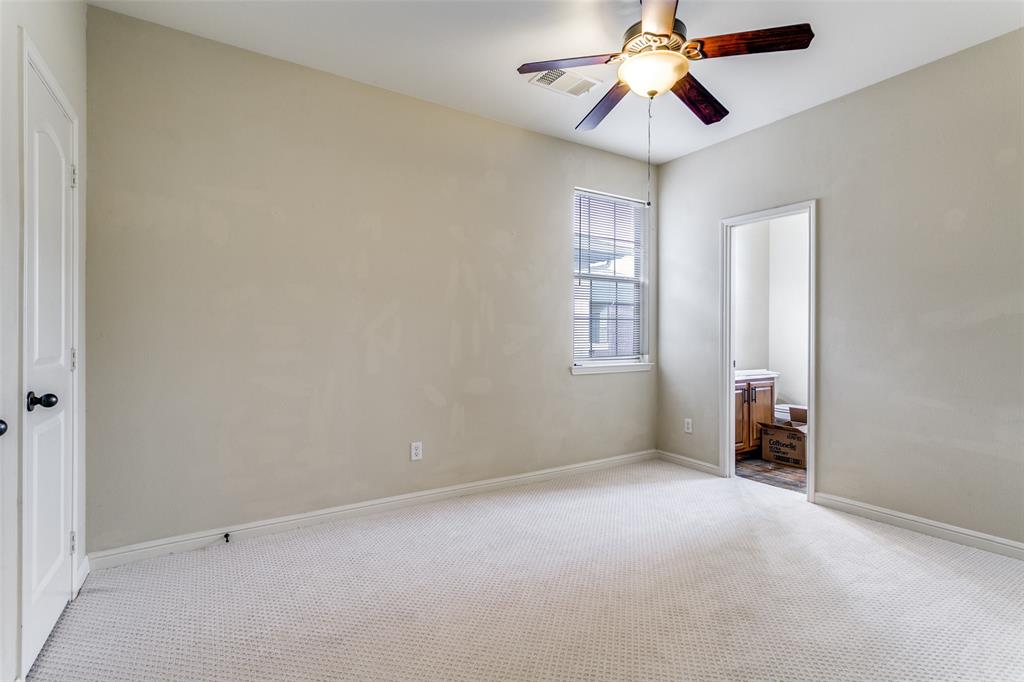 8608 Augustine Road Irving, TX 75063 - Photo 23 of 26 an empty room with closet and windows
