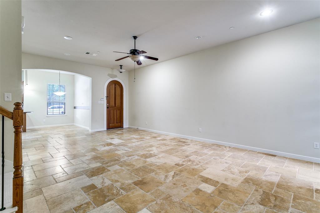 8608 Augustine Road Irving, TX 75063 - Photo 5 of 26 a view of a livingroom with a chandelier and a rug