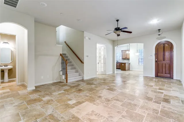 a view of a kitchen with a sink and a fireplace