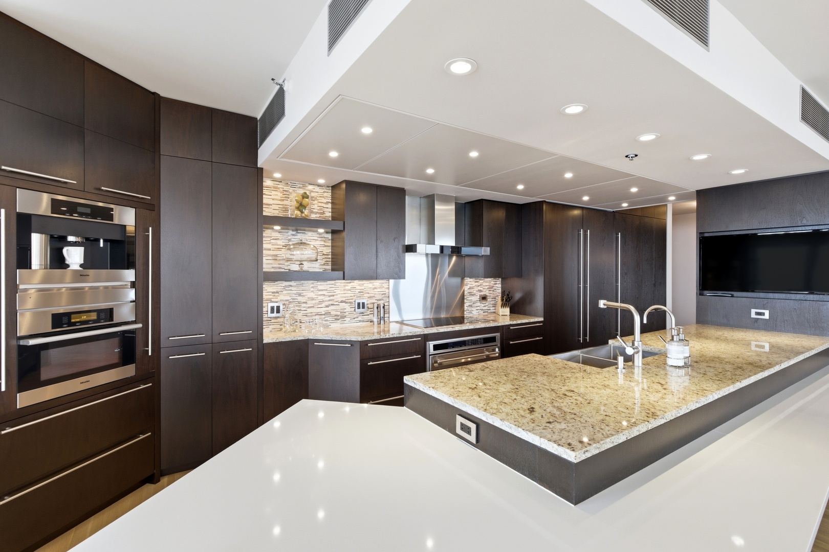 161 East Chicago Avenue, Unit 53A Chicago, IL 60611 - Photo 11 of 47 a kitchen with stainless steel appliances granite countertop a sink stove and refrigerator