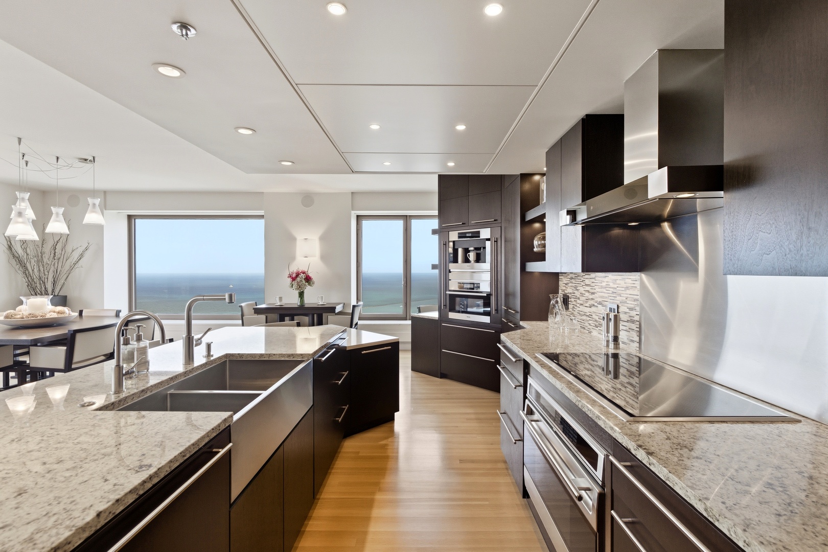 161 East Chicago Avenue, Unit 53A Chicago, IL 60611 - Photo 15 of 47 a large kitchen with stainless steel appliances granite countertop a lot of counter space