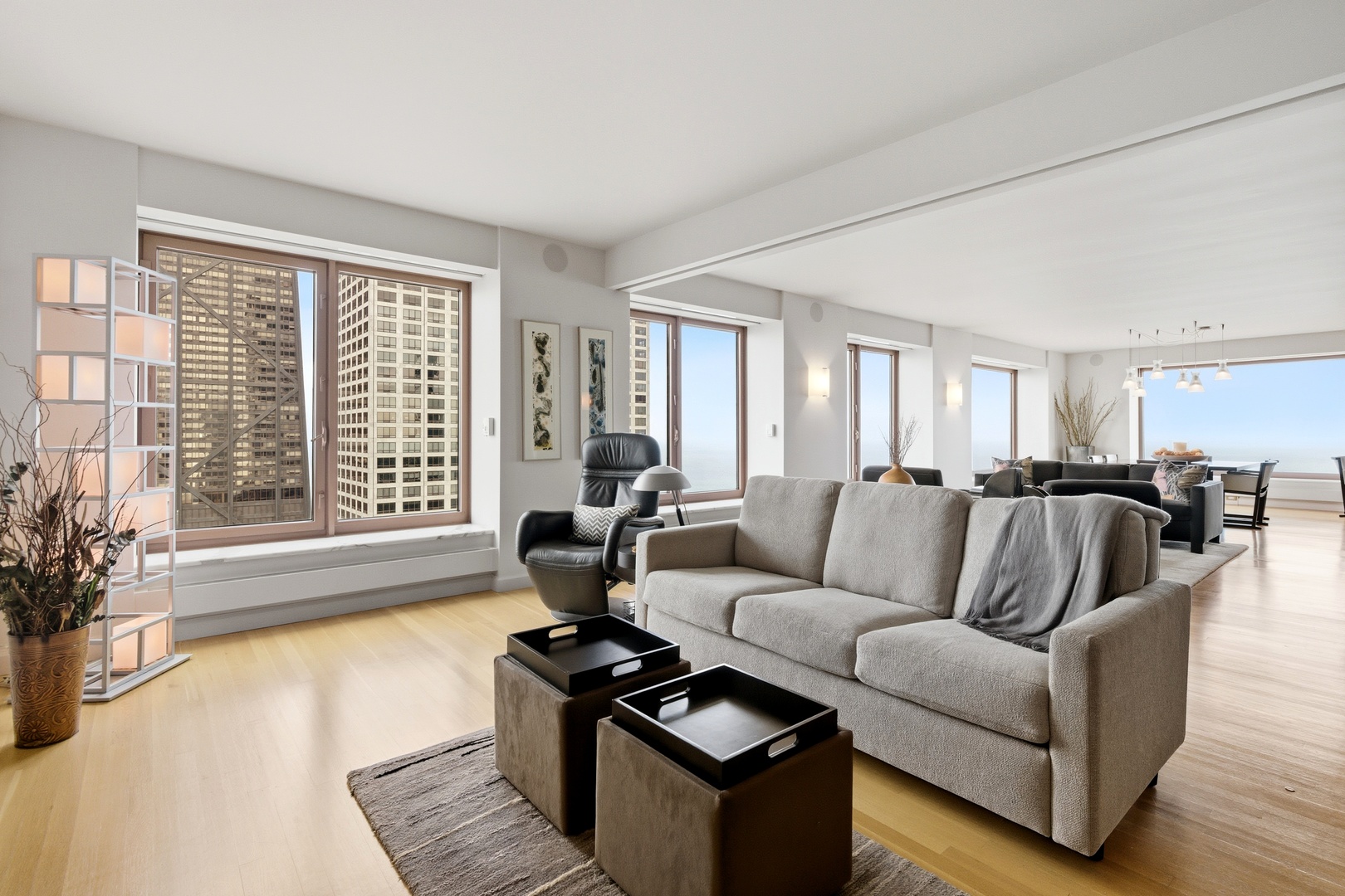 161 East Chicago Avenue, Unit 53A Chicago, IL 60611 - Photo 18 of 47 a living room with furniture and a large window