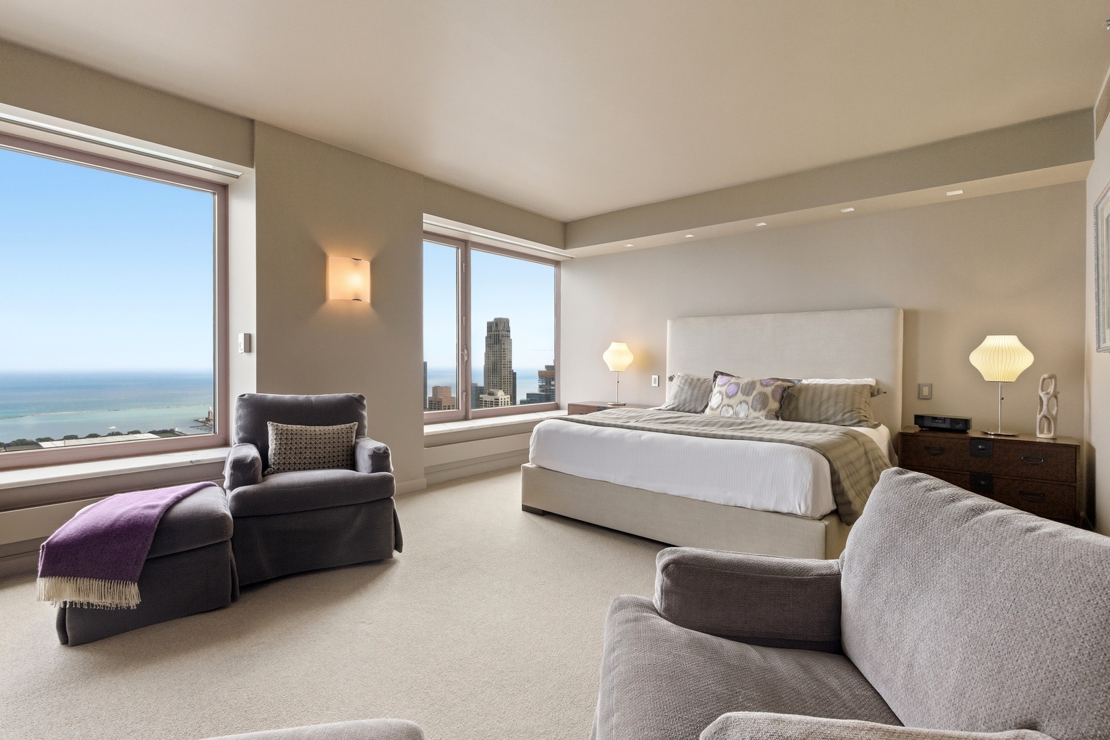 161 East Chicago Avenue, Unit 53A Chicago, IL 60611 - Photo 24 of 47 a bedroom with furniture and a large window