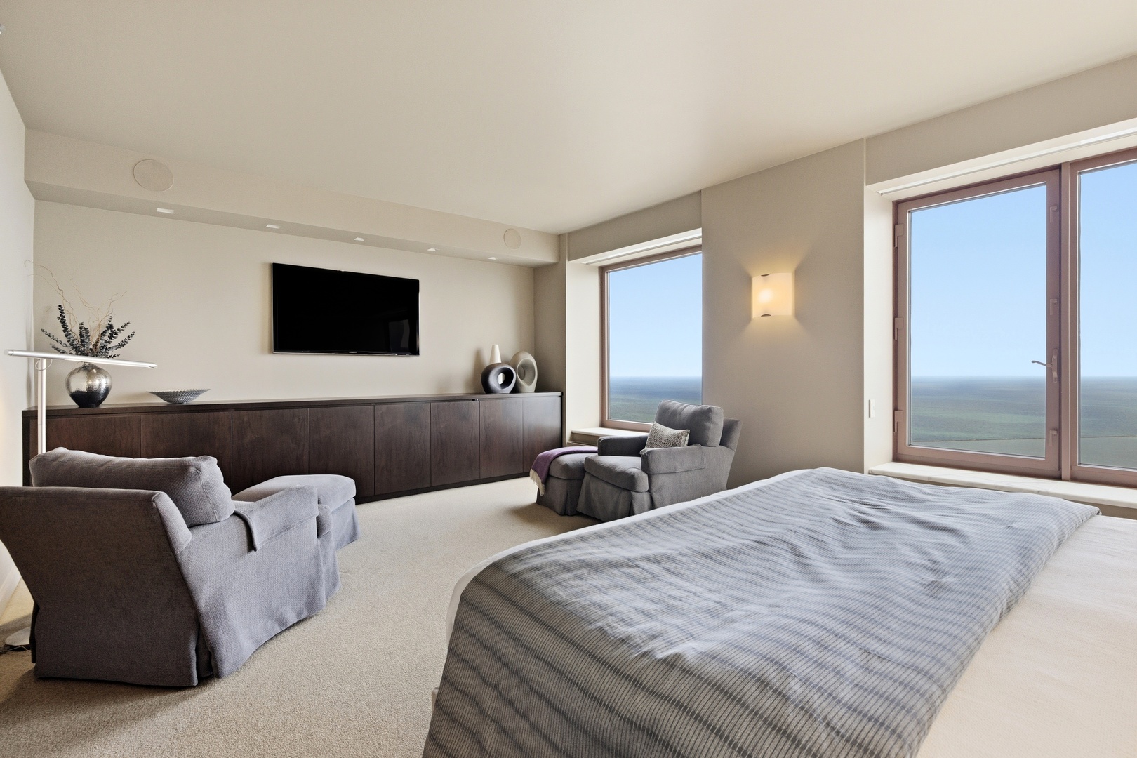 161 East Chicago Avenue, Unit 53A Chicago, IL 60611 - Photo 26 of 47 a bedroom with two beds and a flat screen television