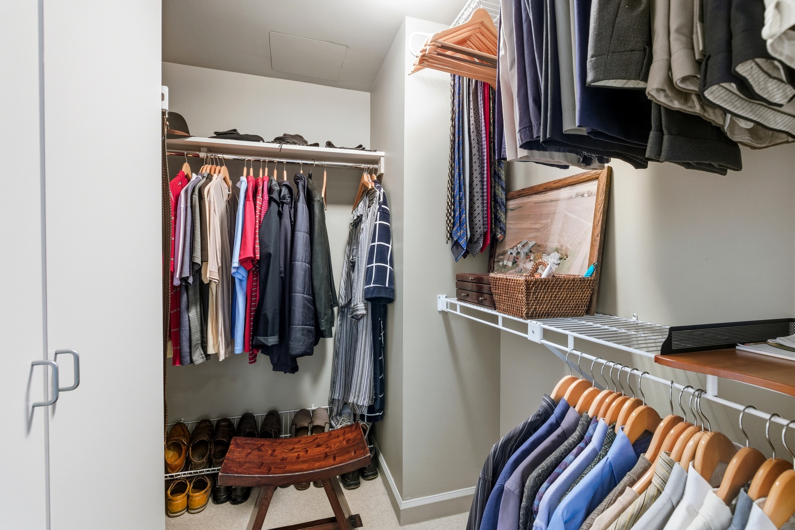 161 East Chicago Avenue, Unit 53A Chicago, IL 60611 - Photo 32 of 47 a view of walk in closet with clothes and shoes