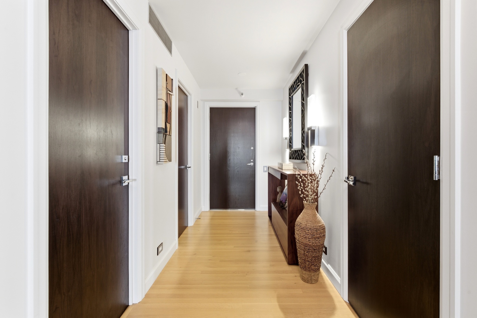 161 East Chicago Avenue, Unit 53A Chicago, IL 60611 - Photo 34 of 47 a en suite bathroom with a granite countertop sink and a mirror