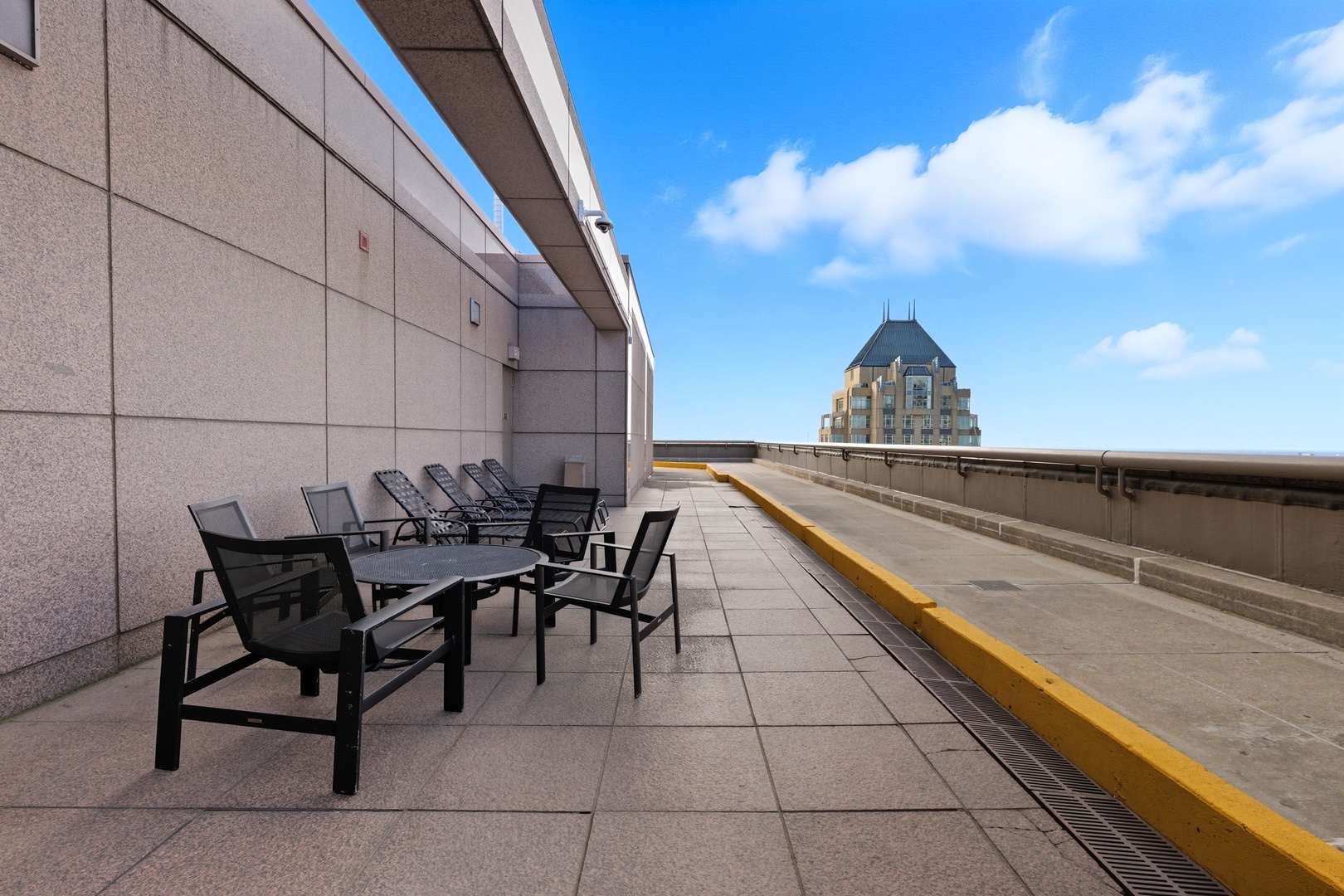 161 East Chicago Avenue, Unit 53A Chicago, IL 60611 - Photo 42 of 47 a terrace with outdoor seating and city view