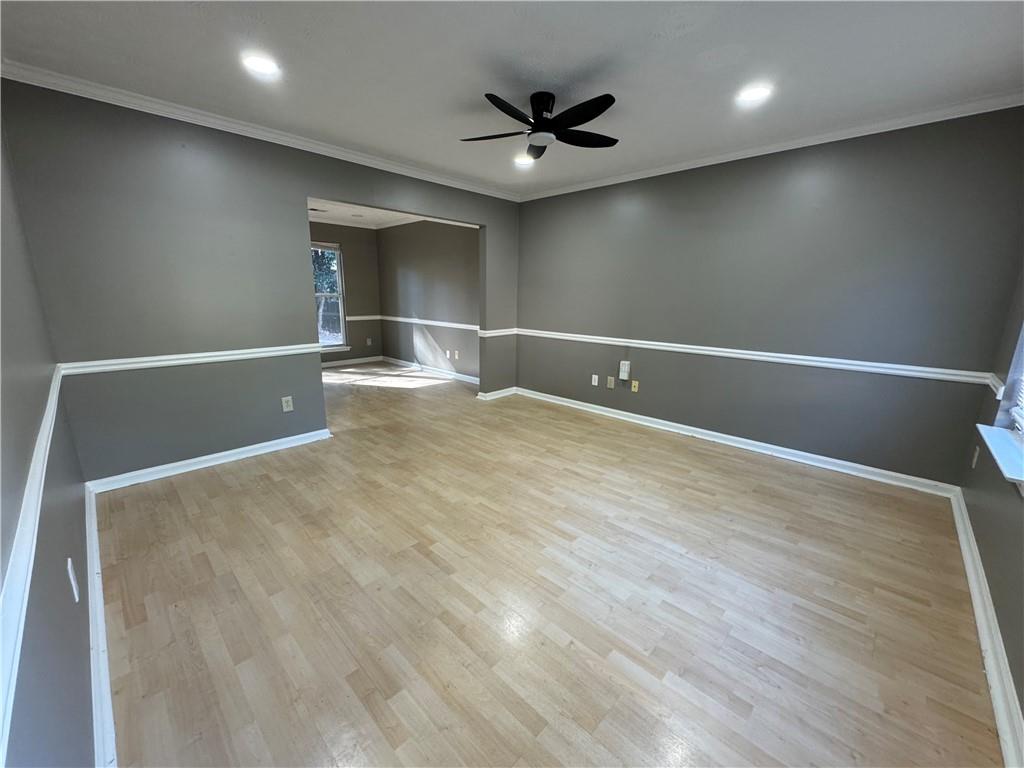 2630 Garland Way Duluth, GA 30096 - Photo 16 of 22 a view of empty room with wooden floor and fan