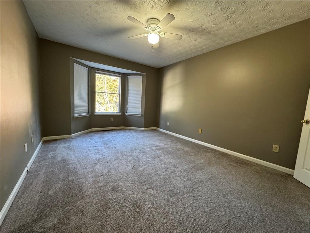 2630 Garland Way Duluth, GA 30096 - Photo 17 of 22 a view of room with a ceiling fan and window
