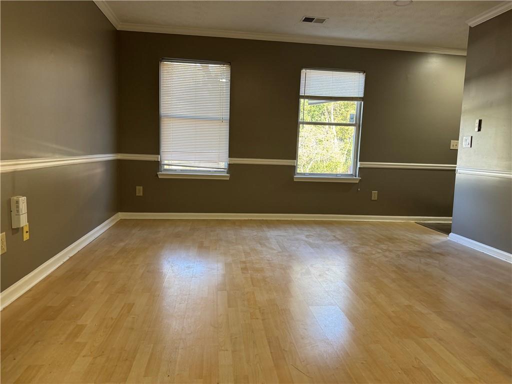 2630 Garland Way Duluth, GA 30096 - Photo 8 of 22 a view of empty room with wooden floor and fan