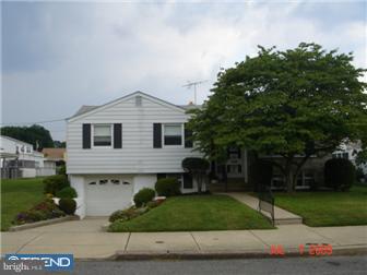 11602 Stevens Road Philadelphia, PA 19116 - Photo 1 of 12 a front view of a house with a garden