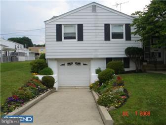 11602 Stevens Road Philadelphia, PA 19116 - Photo 2 of 12 a front view of a house with a yard and a garden