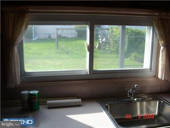 11602 Stevens Road Philadelphia, PA 19116 - Photo 12 of 12 a kitchen with a window a sink and a counter