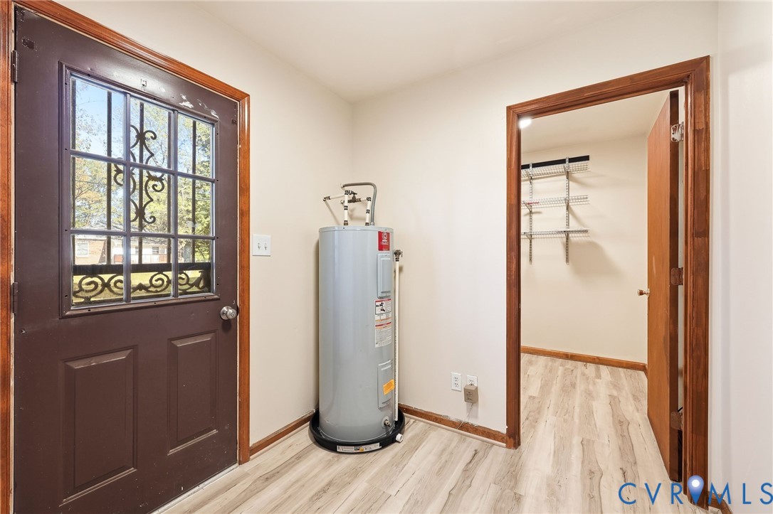 2521 Fort Lee Road Petersburg, VA 23805 - Photo 22 of 27 a view of a hallway with wooden floor and closet