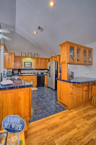 a bedroom with two beds and painting on the wall