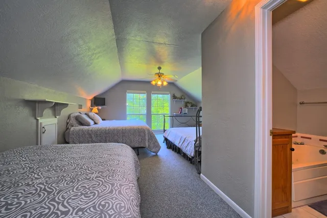 a bathroom with a toilet a sink and a mirror