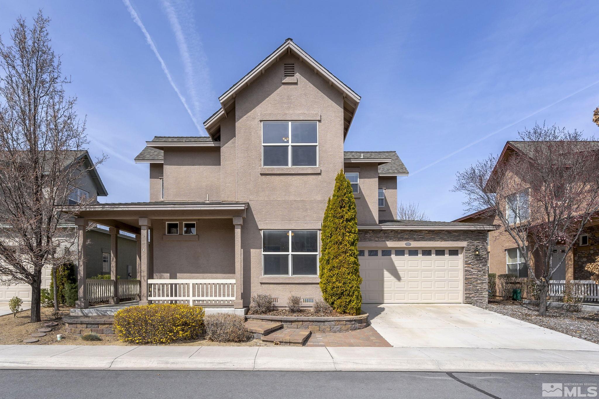 1026 Floral Ridge Way Sparks, NV 89436 - Photo 1 of 22 a front view of a house with garage and garage