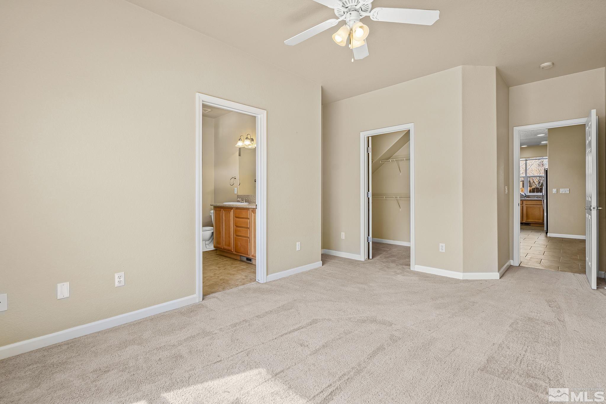 1026 Floral Ridge Way Sparks, NV 89436 - Photo 11 of 22 an empty room with fan and entrance