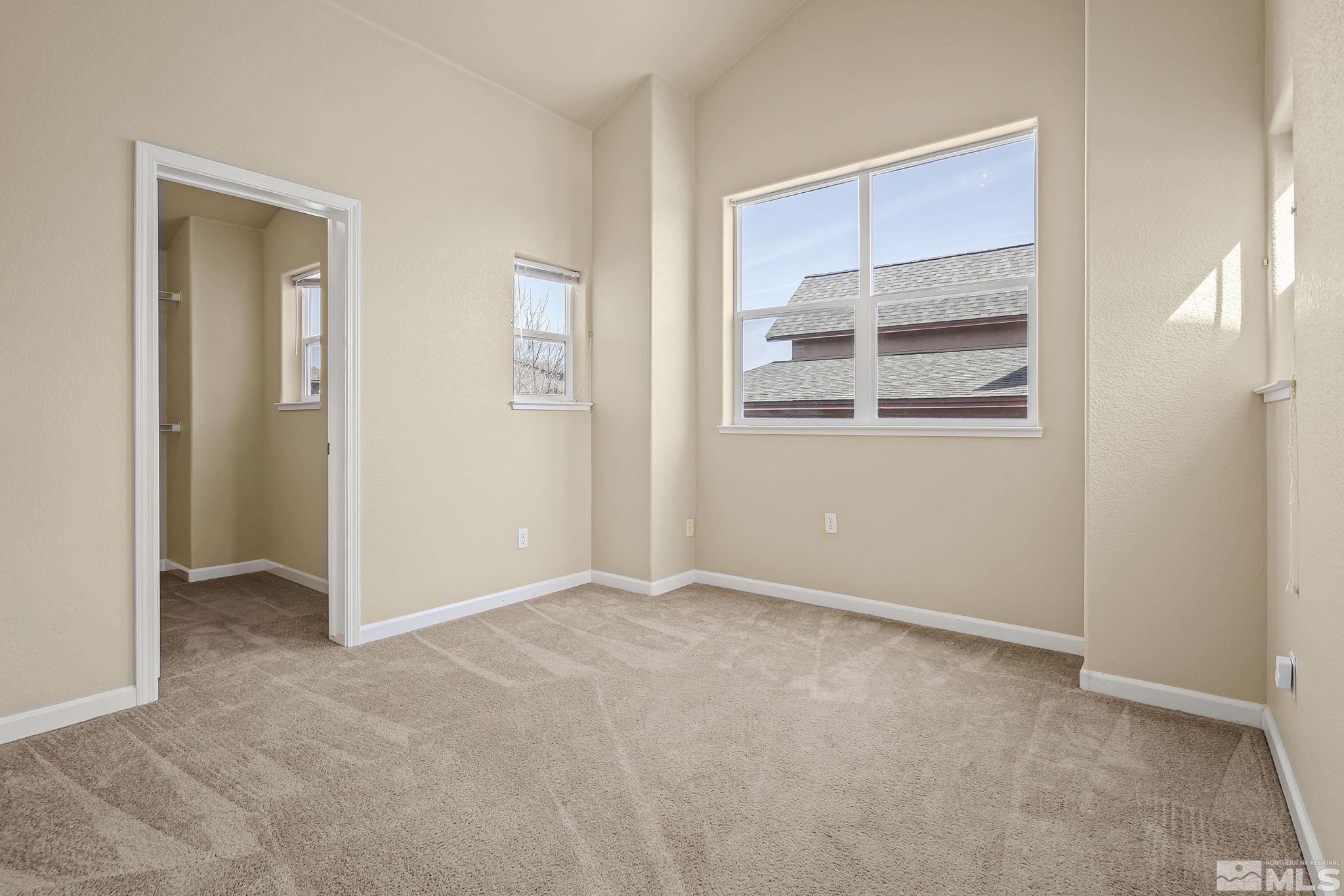 1026 Floral Ridge Way Sparks, NV 89436 - Photo 16 of 22 an empty room with windows and closet
