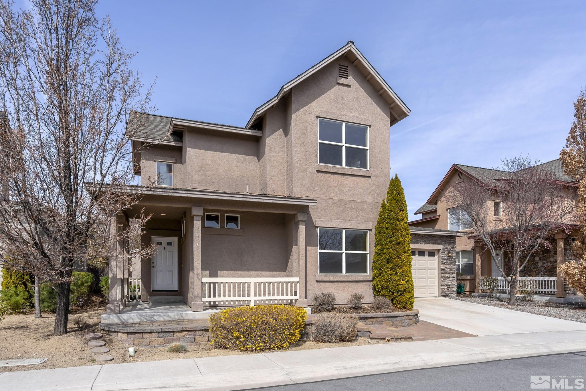 1026 Floral Ridge Way Sparks, NV 89436 - Photo 2 of 22 a front view of a house with a yard
