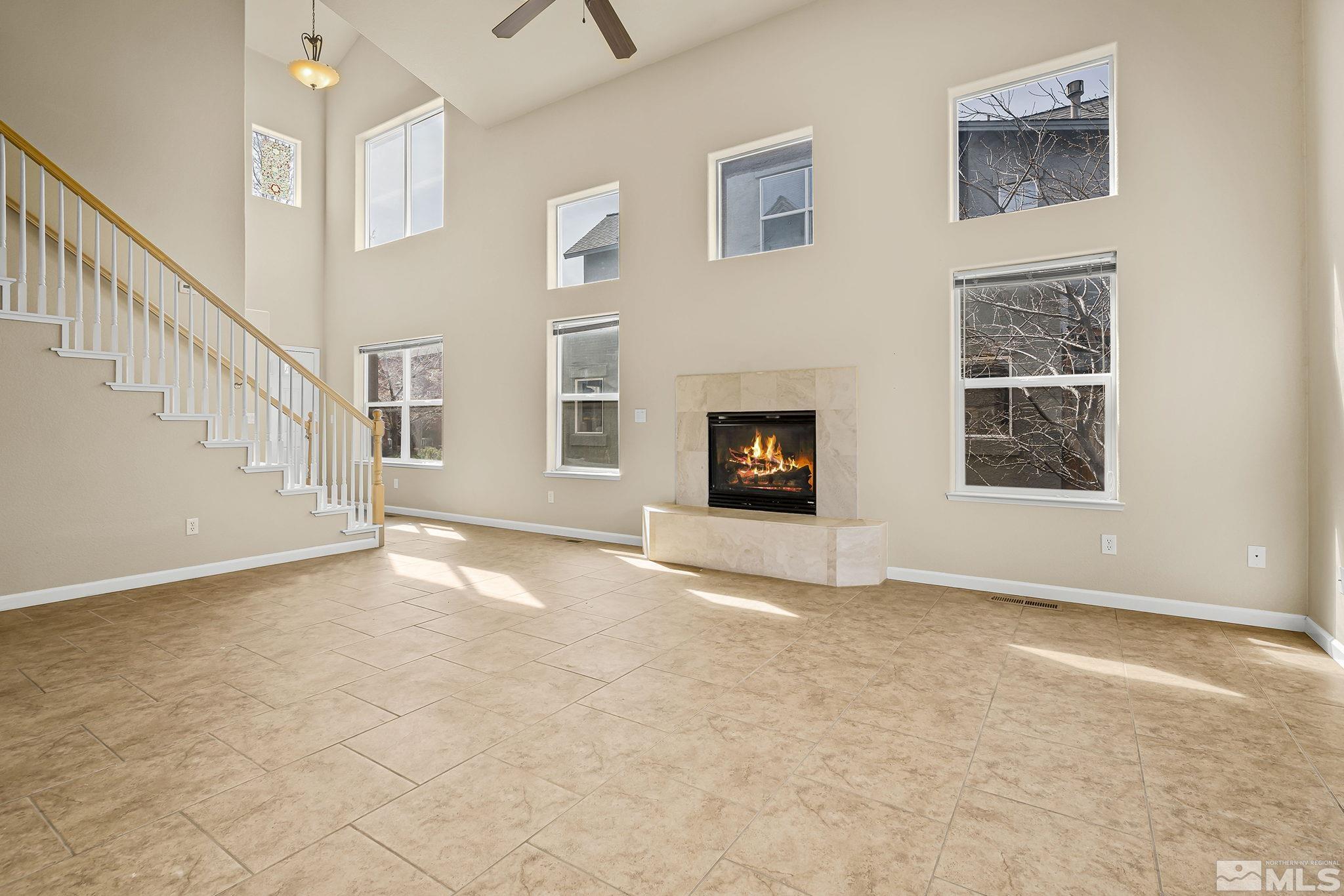 1026 Floral Ridge Way Sparks, NV 89436 - Photo 6 of 22 a view of an empty room with a window and fireplace