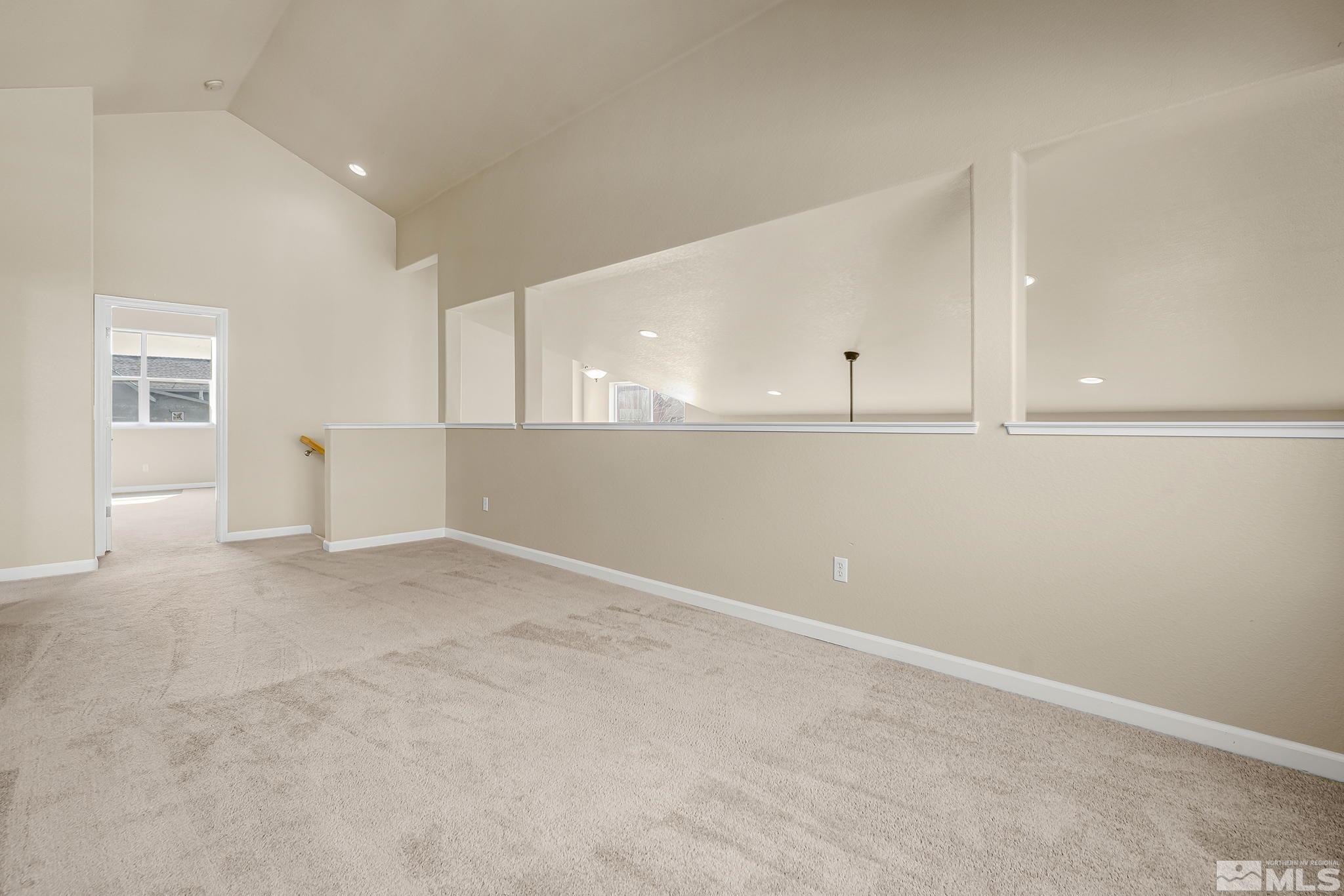 1026 Floral Ridge Way Sparks, NV 89436 - Photo 9 of 22 a view of an empty room with a window