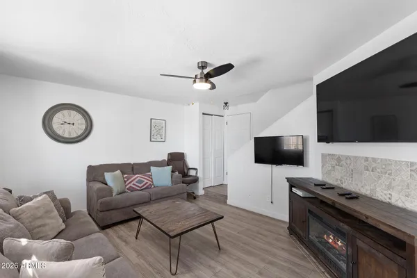 a living room with furniture and a flat screen tv