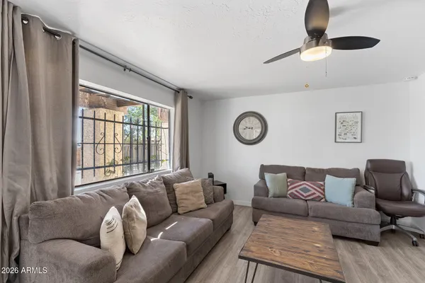 a living room with furniture and a fireplace