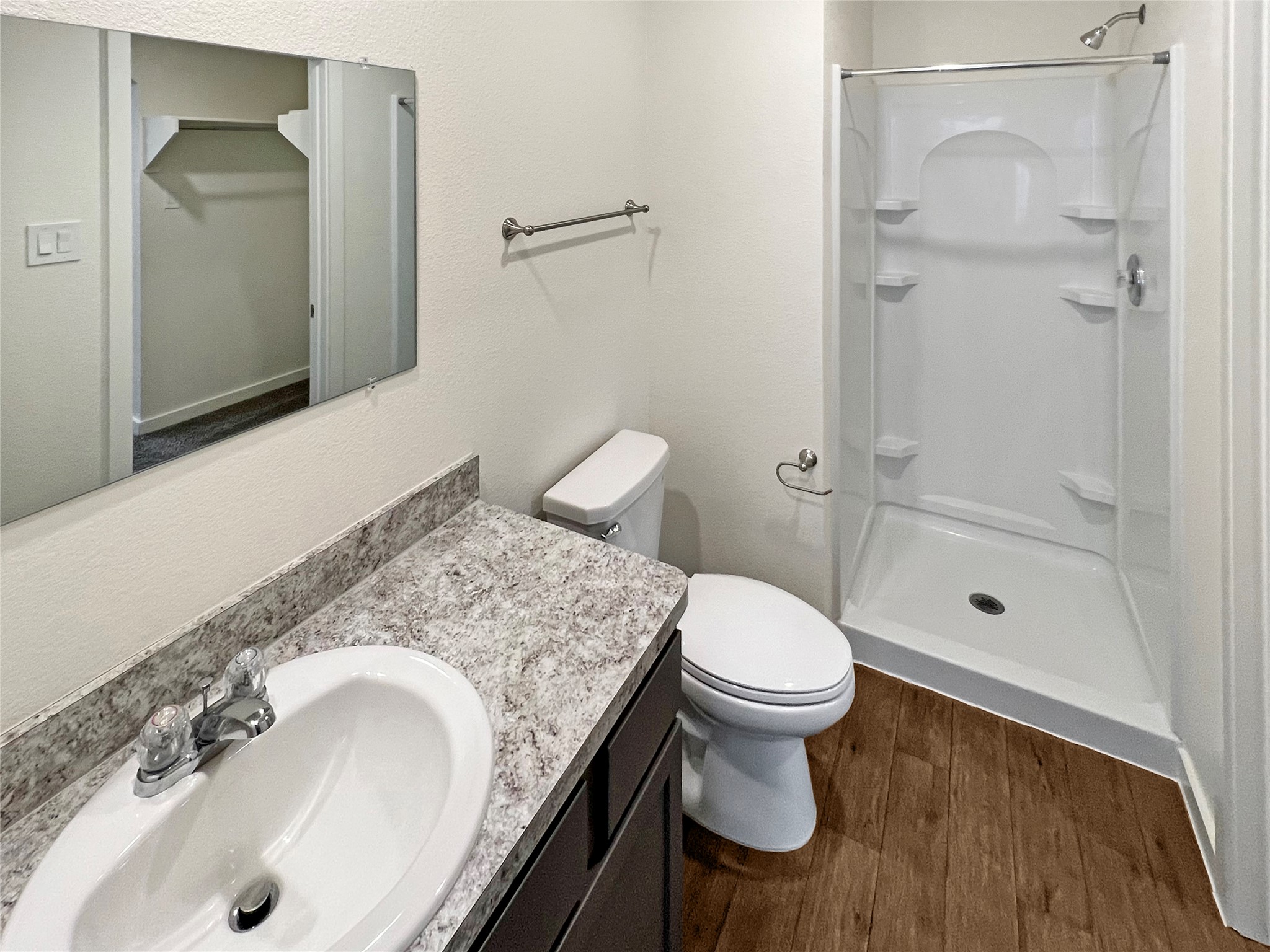 12603 Telge Road, Unit 8EH Cypress, TX 77429 - Photo 21 of 32 a bathroom with a granite countertop sink toilet and shower