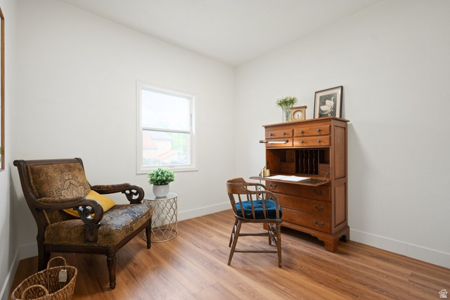 673 East 700 South Springville, UT 84663 - Photo 22 of 43 Bright interior space featuring wood-finish flooring, white walls, and a single window with white trim