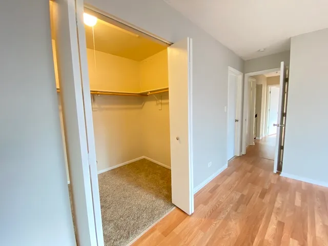 a view of hallway with wooden floor