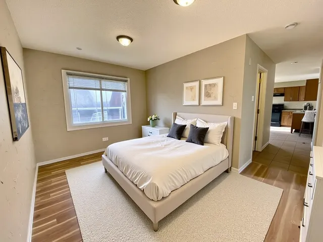 a bedroom with bed and window