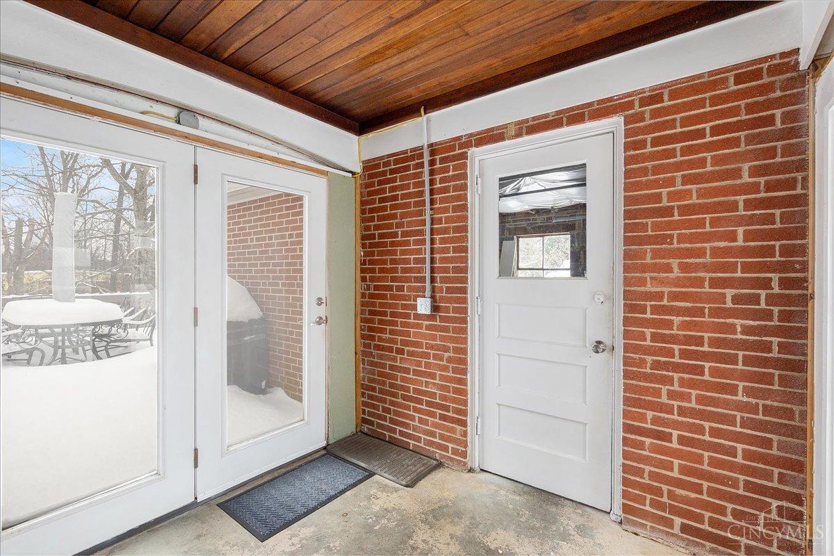 7634 Forest Road Cincinnati, OH 45255 - Photo 23 of 25 Breezeway from garage to the kitchen with access to the back deck.