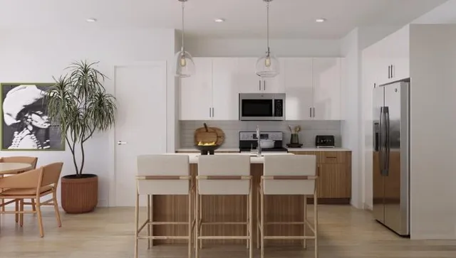 a view of kitchen with furniture and refrigerator