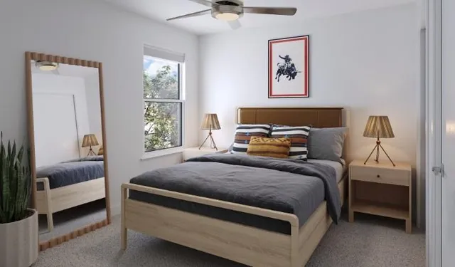 a bedroom with a bed and a window