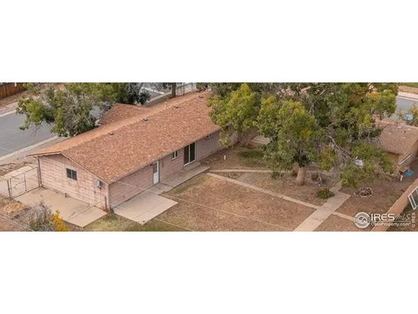 a upper view of a house with a yard