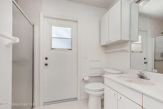 a bathroom with a sink toilet and vanity