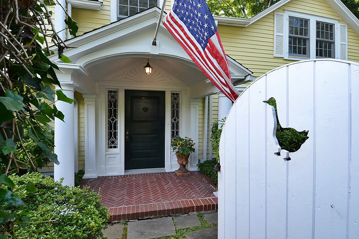 112 Brushy Ridge Road New Canaan, CT 06840 - Photo 1 of 45 a front view of a house with a yard