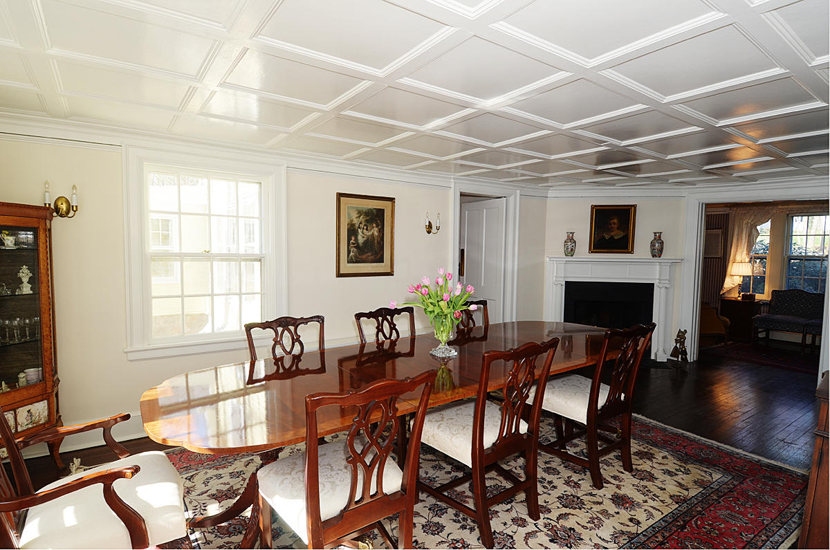 112 Brushy Ridge Road New Canaan, CT 06840 - Photo 11 of 45 a dining room with furniture a fireplace and wooden floor