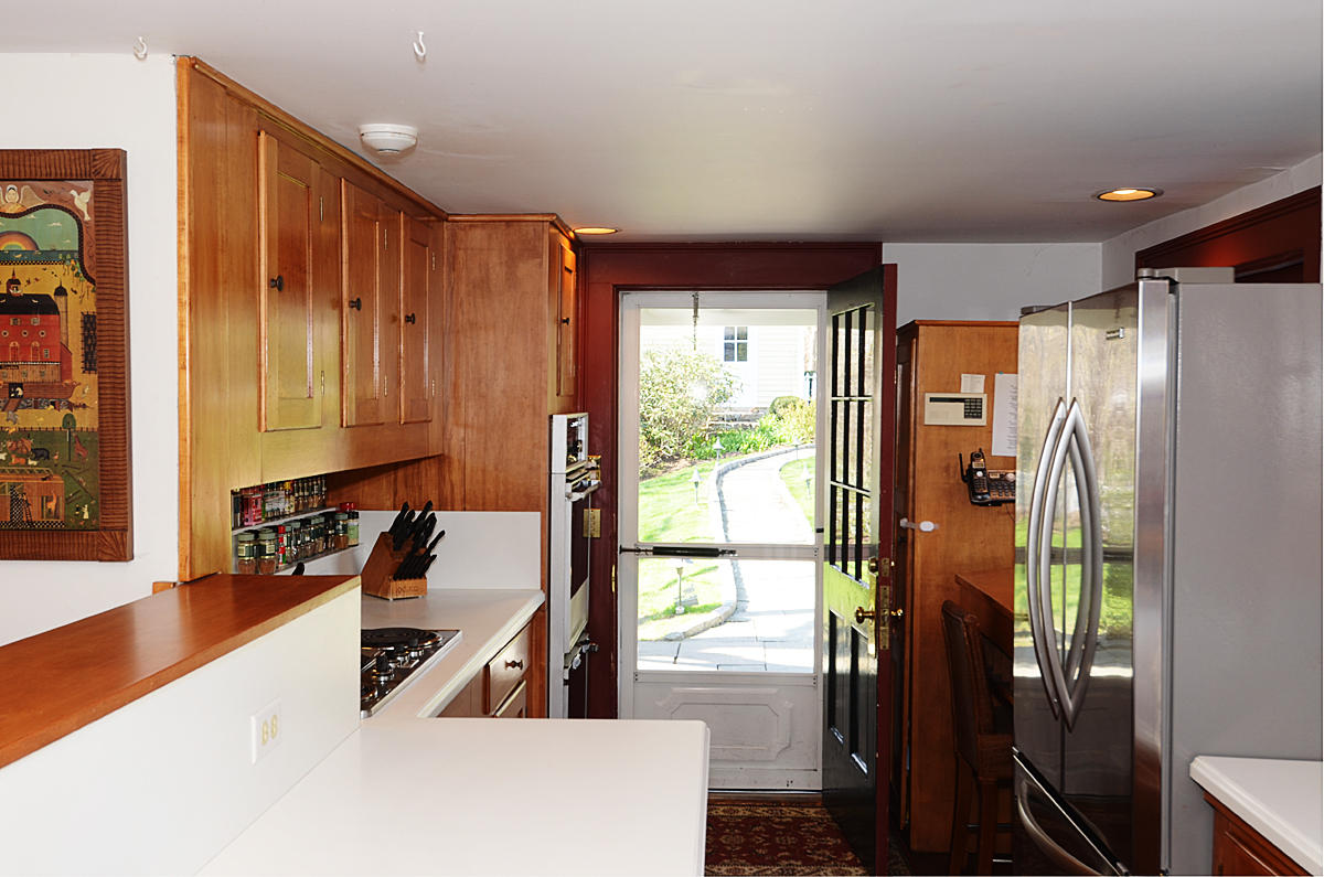 112 Brushy Ridge Road New Canaan, CT 06840 - Photo 16 of 45 a kitchen with stainless steel appliances granite countertop a refrigerator and a sink