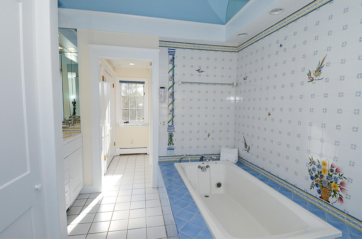 112 Brushy Ridge Road New Canaan, CT 06840 - Photo 22 of 45 a bathroom with a bathtub and a shower