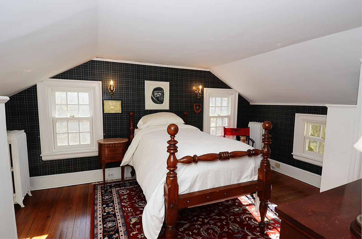 112 Brushy Ridge Road New Canaan, CT 06840 - Photo 25 of 45 a living room with furniture and a flat screen tv