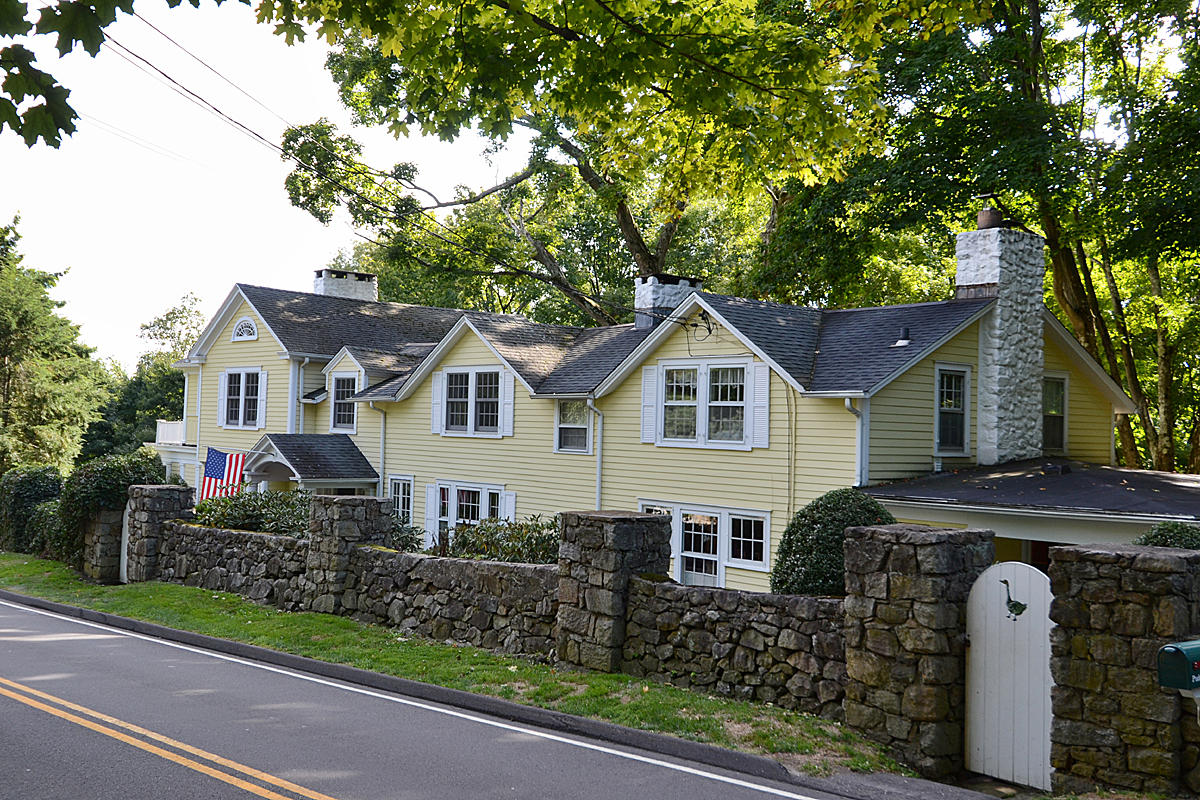 112 Brushy Ridge Road New Canaan, CT 06840 - Photo 3 of 45 a front view of a house with garden