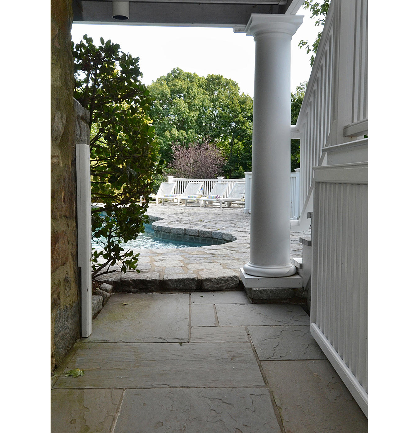 112 Brushy Ridge Road New Canaan, CT 06840 - Photo 37 of 45 a view of a door and chair in front of a door