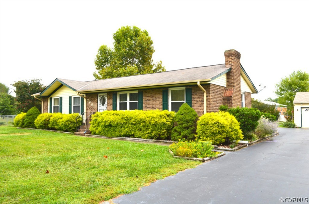 7601 Strath Road Henrico, VA 23231 - Photo 1 of 17 a front view of house with yard and green space