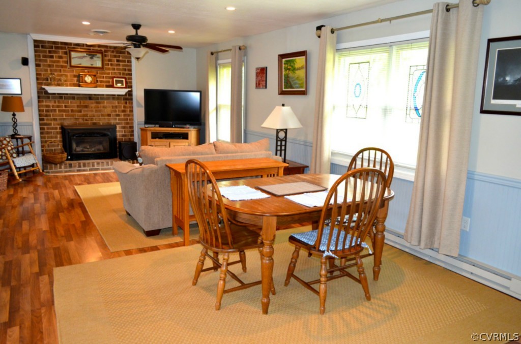 7601 Strath Road Henrico, VA 23231 - Photo 11 of 17 a dining room with furniture and a flat screen tv