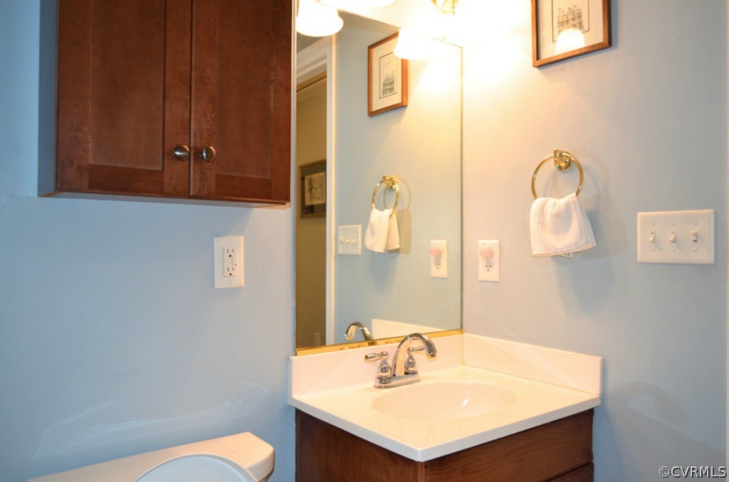 7601 Strath Road Henrico, VA 23231 - Photo 13 of 17 a bathroom with a sink and a mirror