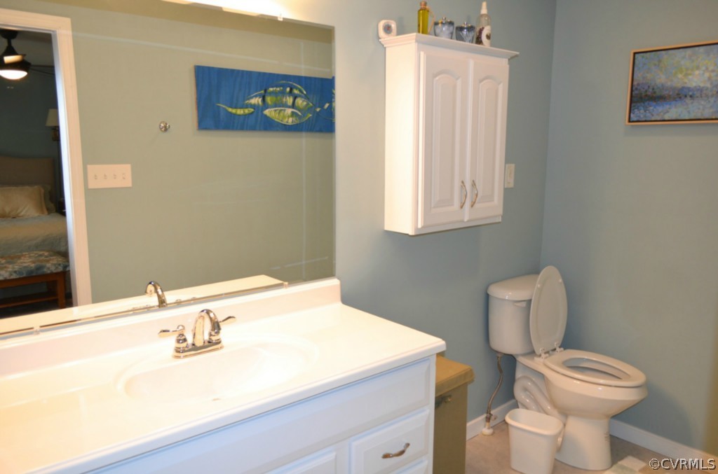 7601 Strath Road Henrico, VA 23231 - Photo 15 of 17 a bathroom with a toilet a sink and mirror