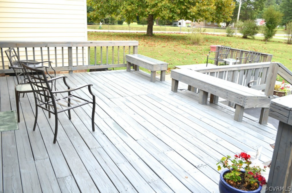 7601 Strath Road Henrico, VA 23231 - Photo 16 of 17 a view of a balcony with wooden floor and outdoor seating