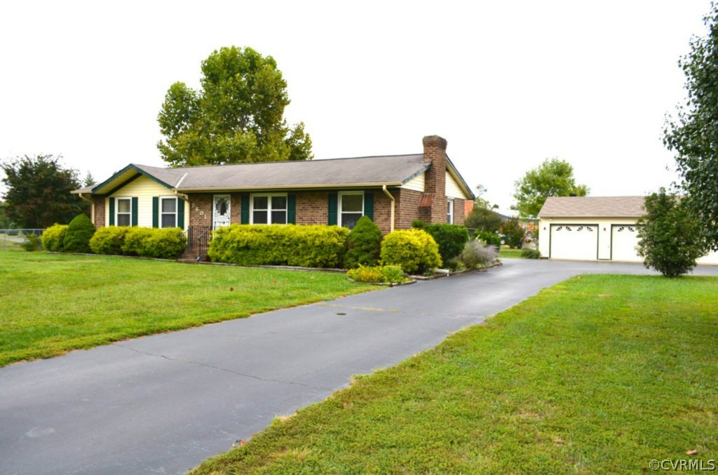7601 Strath Road Henrico, VA 23231 - Photo 2 of 17 a front view of a house with garden